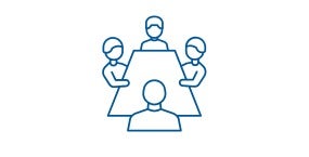 members around a table talking